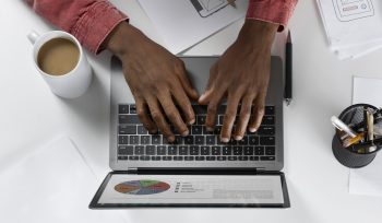 top-view-hands-typing-keyboard